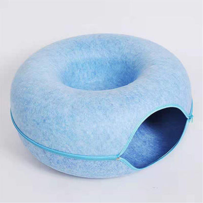 Blaues Katzenbett aus Filz, rund, mit Reißverschluss, gemütlich, modernes Design.