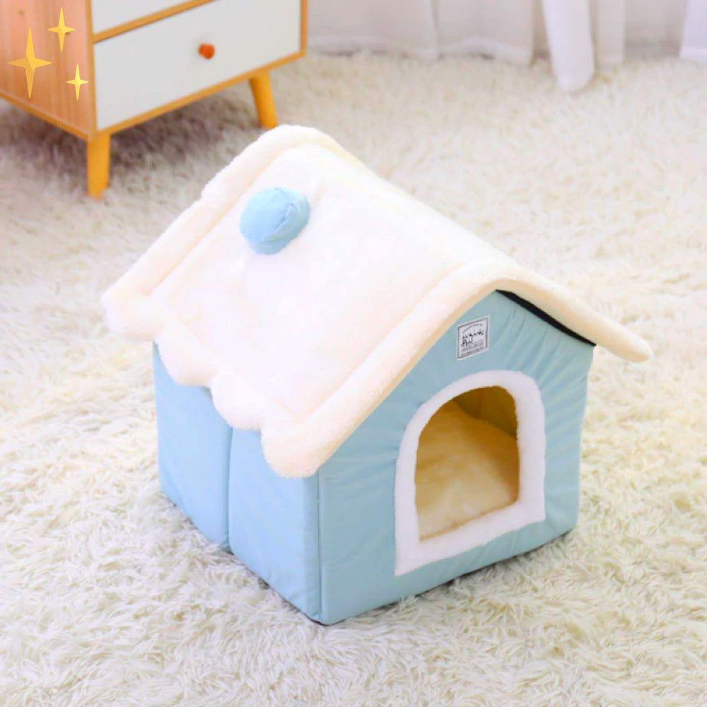 Blaue Hundehütte aus Stoff mit weißem Dach auf Teppich, gemütliches Haustierbett.