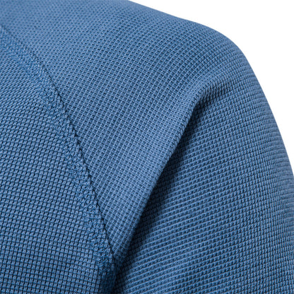 Blauer Textilstoff, Nahaufnahme, strukturierte Oberfläche, Polyester, Bekleidungsmaterial.
