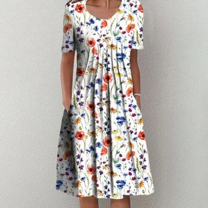 Damen Sommerkleid, weiß mit buntem Blumenmuster, kurzärmelig, knielang, lässig.