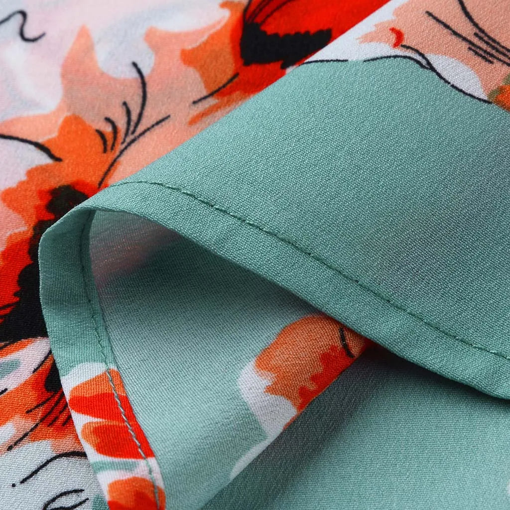 Grüner und orangefarbener Blumenstoff, Polyester, weich, für Kleidung und Dekoration.