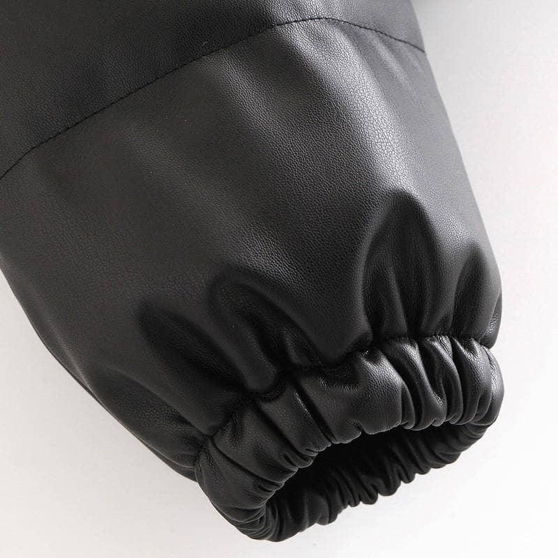 Schwarze Lederjacke Ärmel, elastischer Bund, modisch, hochwertiges Material.