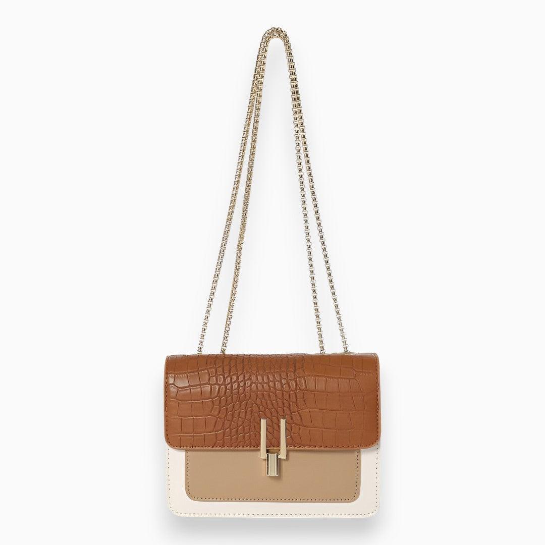 Braune Krokodilleder-Handtasche mit Kettenriemen, elegante Damenmode, stilvolles Accessoire.