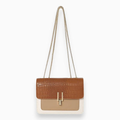 Braune Krokodilleder-Handtasche mit Kettenriemen, elegante Damenmode, stilvolles Accessoire.