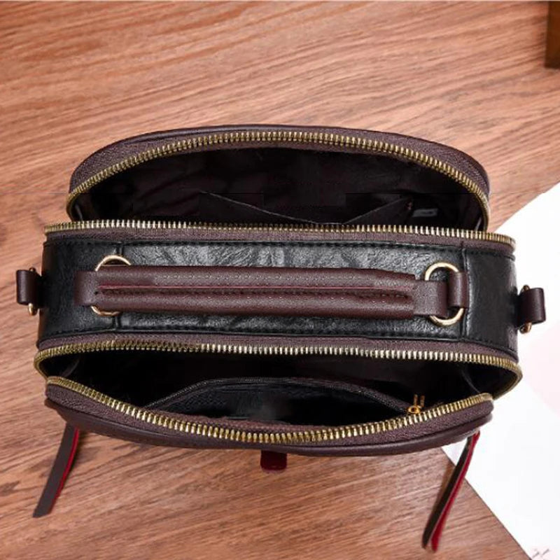 Braune Lederhandtasche mit Reißverschluss, elegante Damenmode, stilvolles Accessoire
