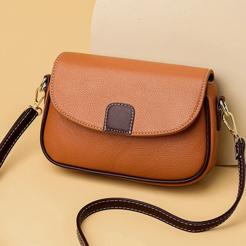 Braune Leder-Umhängetasche mit verstellbarem Riemen, elegantes Design, Damenmode Accessoire.
