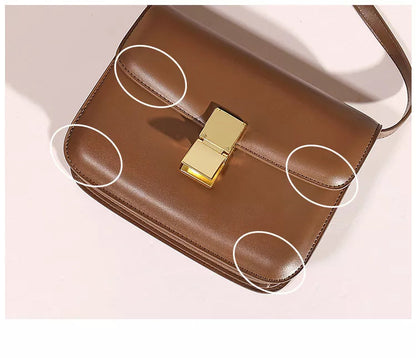 Braune Ledertasche mit goldener Schnalle, elegante Damenhandtasche, modisches Accessoire.
