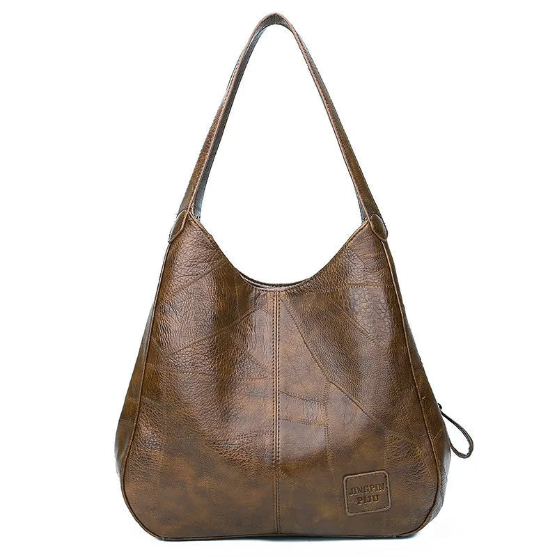 Braune Lederhandtasche für Damen, modisch, geräumig, mit Schulterriemen, elegant.