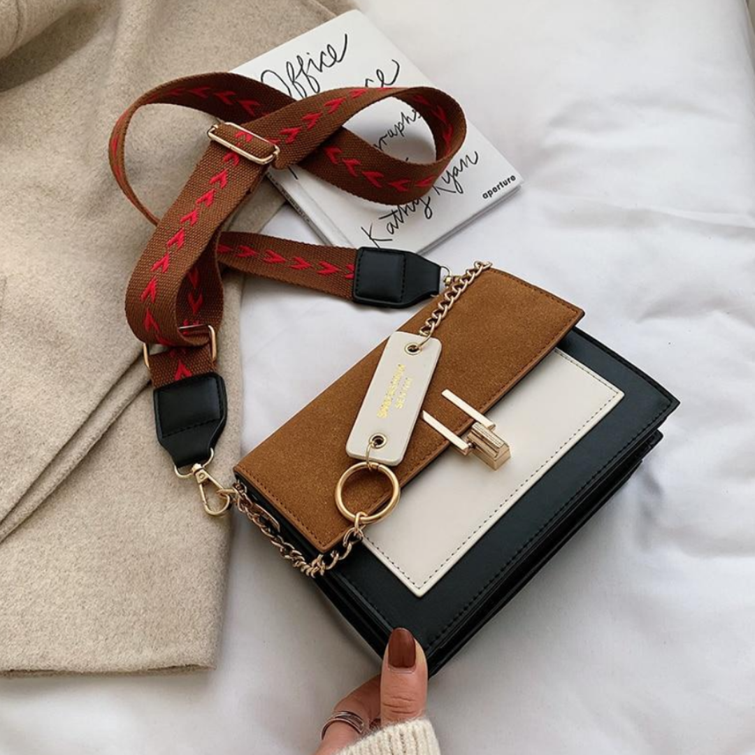 Damenhandtasche aus Leder, braun-schwarz, mit Kettenriemen und goldenen Details, modisch.