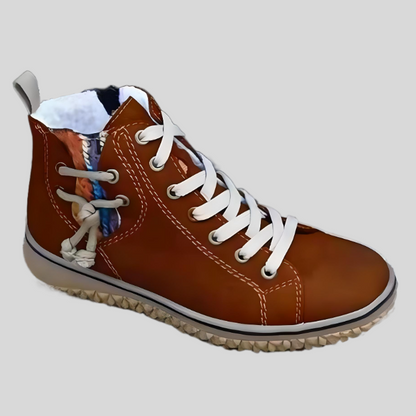 Brauner Damen-Sneaker aus Leder mit weißen Schnürsenkeln und seitlichem Zierknoten.
