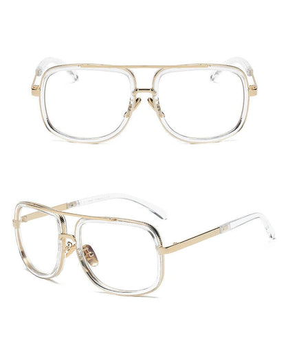 Goldene, rechteckige Brille mit transparenten Gläsern, Unisex-Design, modisch und elegant.