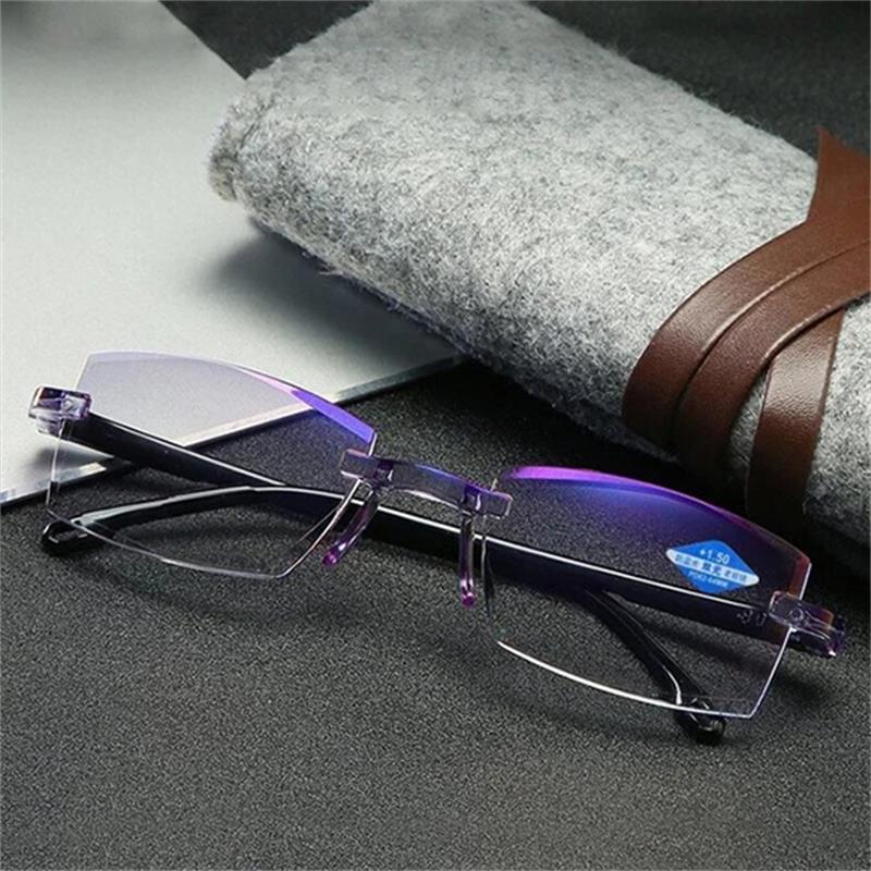 Brille ohne Rahmen, lila Akzente, auf grauem Filzetui, modisch, elegant, hochwertig.