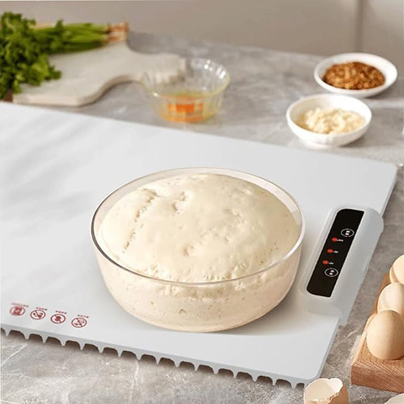 Teig in Glasschüssel auf Gärmatte, Küche, Brotbacken, Hefeteig, Zubereitung, Backzubehör.