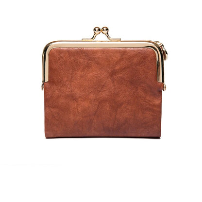 Braune Leder-Geldbörse mit goldfarbenem Rahmen, Vintage-Stil, Damen-Accessoire.