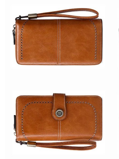 Braune Leder-Geldbörse mit Reißverschluss und Armband, stilvoll und praktisch für Damen.