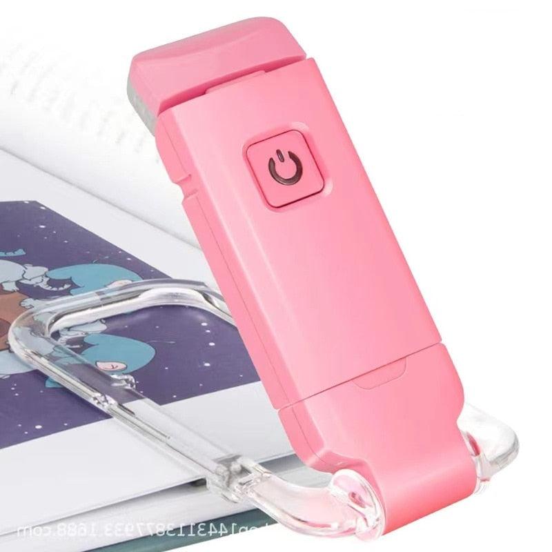 Rosa LED-Leselampe für Bücher, tragbar, USB-aufladbar, ideal für Reisen und Nachtlesen.