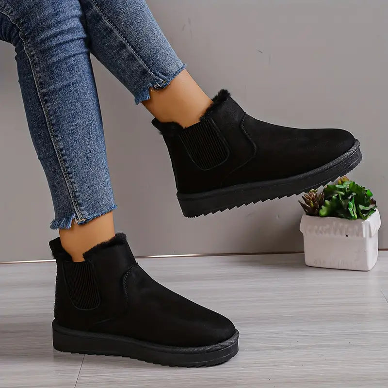 Schwarze Damen-Winterstiefel aus Wildleder, flach, mit Fellfutter, modisch, bequem.