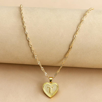 Goldene Herz-Halskette mit Kreuzanhänger, elegantes Schmuckstück, Damenmode, Geschenkidee.
