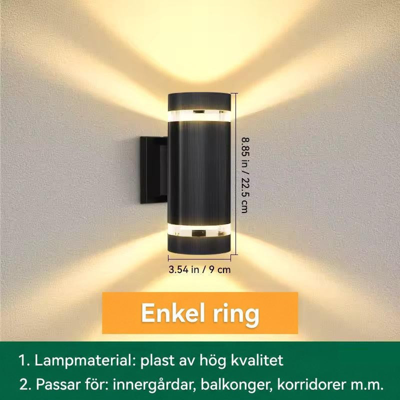 Måttbild av cylindrisk vägglampa med ett ljusband upptill och nedtill, höjd och diameter angivna 13