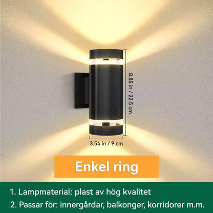 Måttbild av cylindrisk vägglampa med ett ljusband upptill och nedtill, höjd och diameter angivna 13
