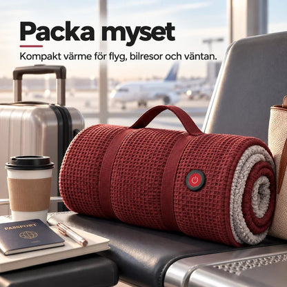 Hopvikt röd filt med handtag och strömknapp på en flygplatsstol bredvid kaffekopp och resväska 12