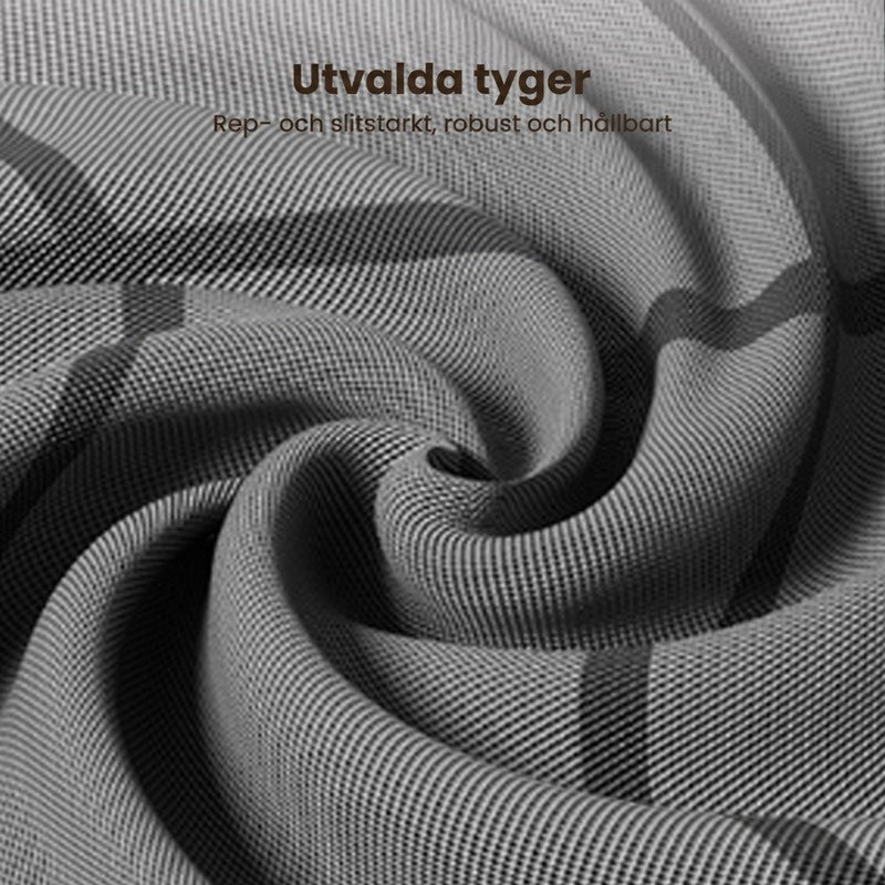Extrem närbild på det mörkgrå vävda tyget med rutmönster, vridet i en virvel så att strukturen syns. 10