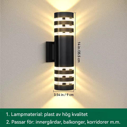 Måttbild av lång cylindrisk vägglampa med tre ljusband upptill och nedtill, höjd och diameter angivna 15