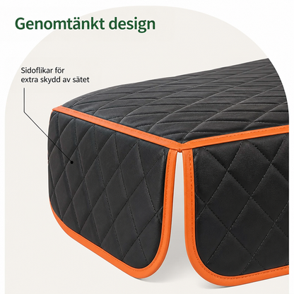Närbild på skyddets sidoflik med orange kantband och diamantquiltning, som ger extra täckning av sätets kant. 4