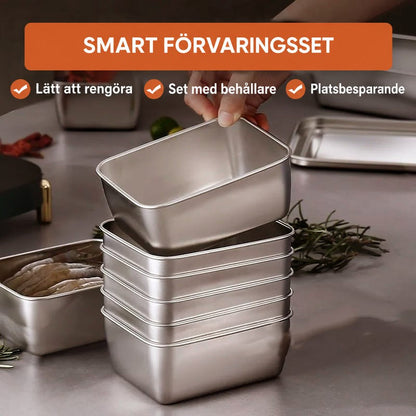 Hand lyfter en burk från en hög med staplade burkar i rostfritt stål på en bänk, med rosmarin bredvid. 4