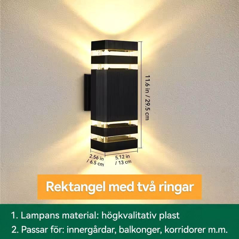 Måttbild av rektangulär vägglampa med två ljusband upptill och nedtill, höjd, bredd och djup angivna 17