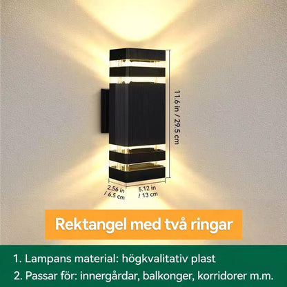 Måttbild av rektangulär vägglampa med två ljusband upptill och nedtill, höjd, bredd och djup angivna 17