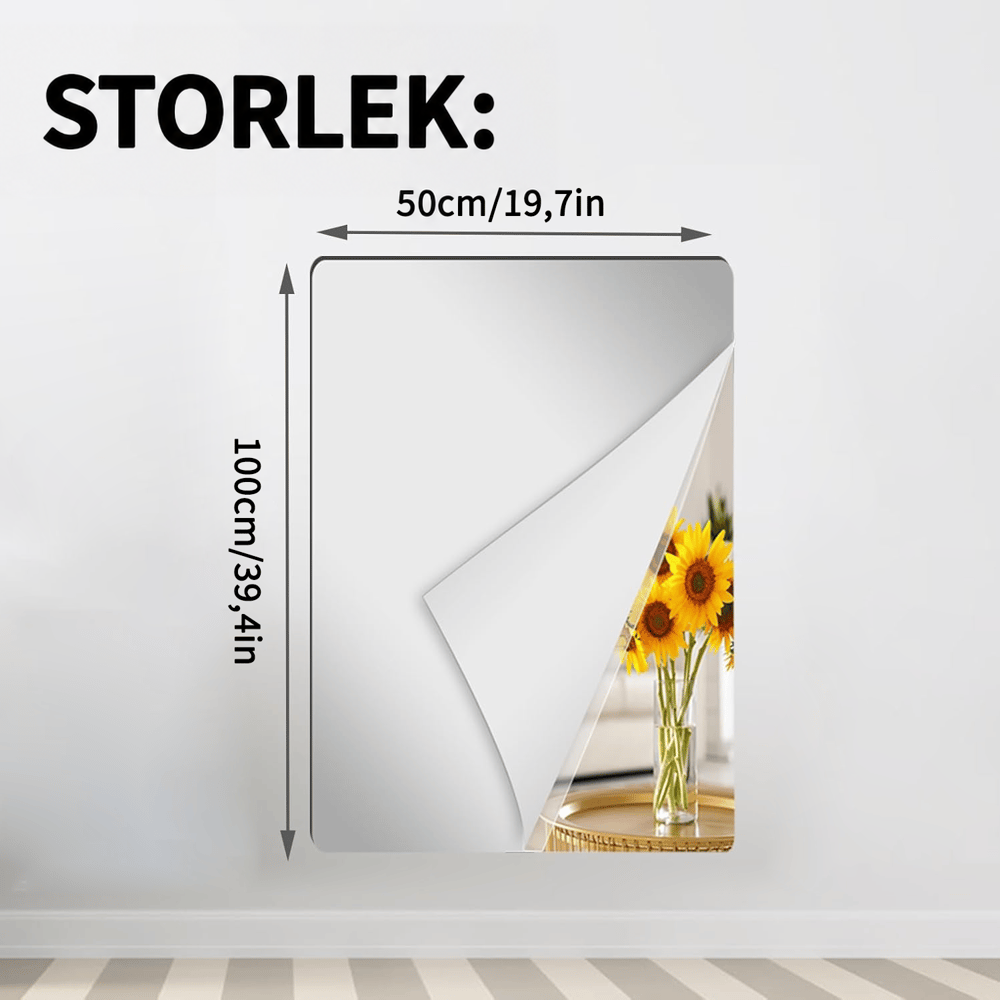 Stående rektangulärt spegelark på en vit vägg med uppvikt hörn som visar solrosor, med måttpilar för ett smalare och högre format. 12