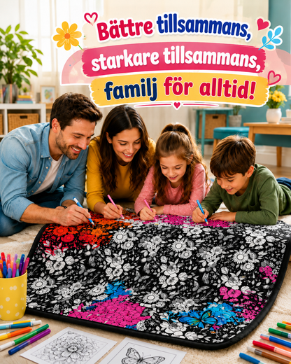 Familj på golvet färglägger tillsammans ett blommönstrat pläd med tygpennor, delvis ifärgat i rosa, blått och orange 3