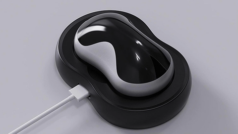 Schwarzes kabelloses Ladegerät mit modernem Design auf grauem Hintergrund.
