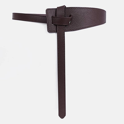 Dunkelbrauner Ledergürtel, minimalistisches Design, modisches Accessoire, Damenmode.
