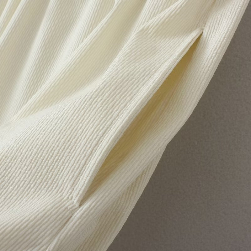 Beige gerippter Stoff, Nahaufnahme, Textur, Mode, Material, Detailansicht, Stoffdesign, Bekleidung.