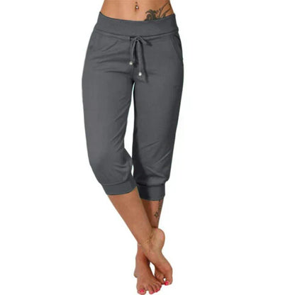 Graue Damen Capri-Yoga-Hose mit Kordelzug, Taschen, bequem, ideal für Sport und Freizeit.