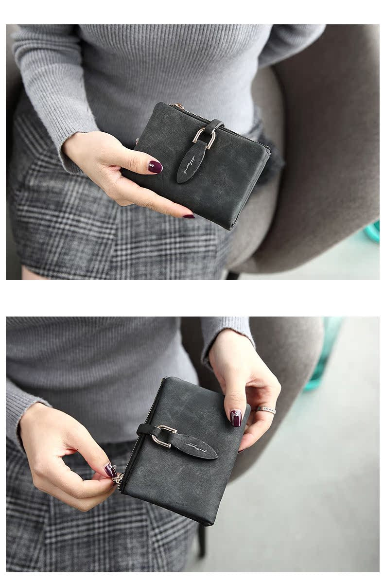 Damenhandtasche aus schwarzem Leder, kompakt, mit Reißverschluss und Schnalle, elegant.