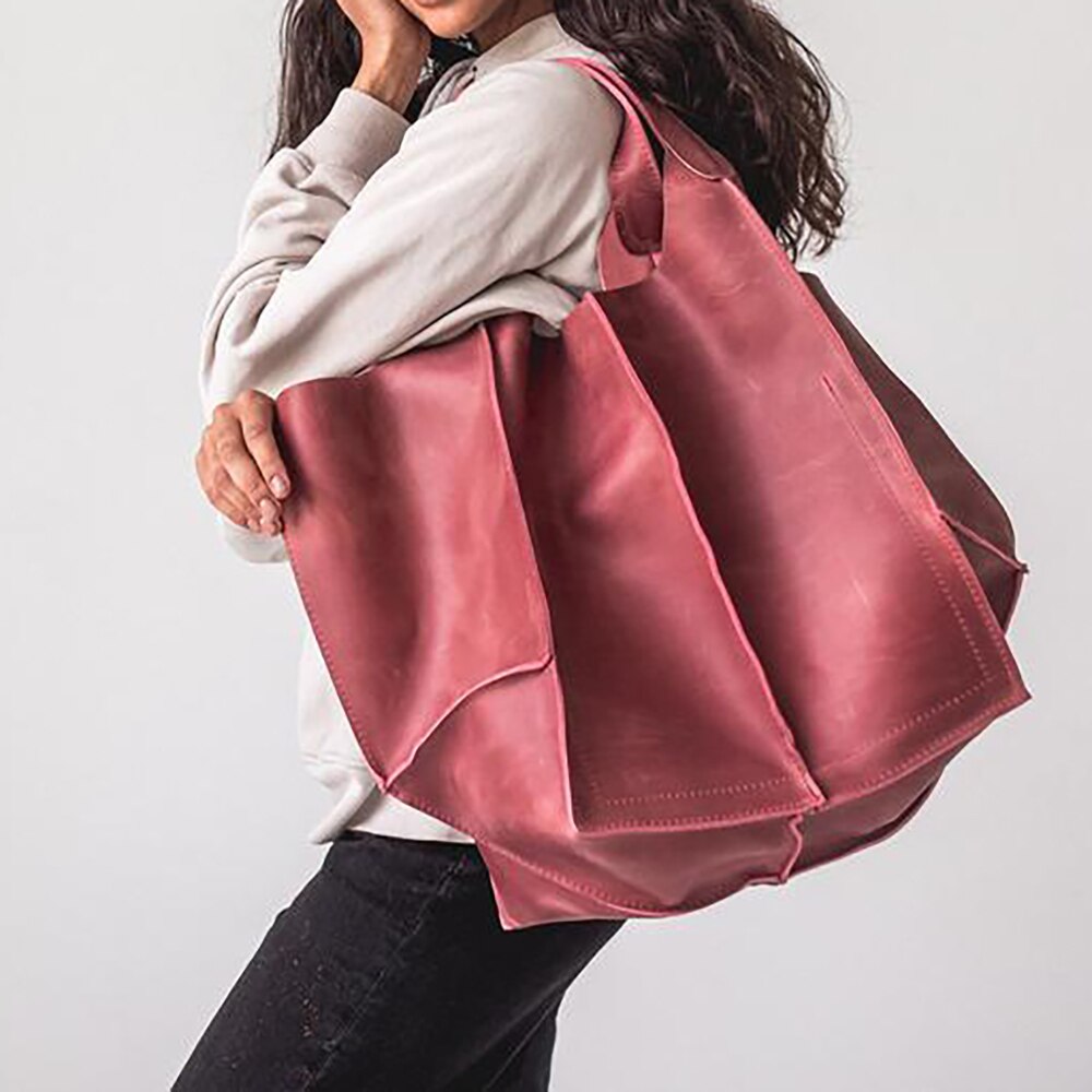 Frau mit großer, rosa Ledertasche, modisch, lässig, Accessoire, Damenmode, Einkaufstasche.