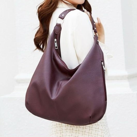 Damenhandtasche aus braunem Leder, Hobo-Stil, modisch, elegant, mit Reißverschluss.