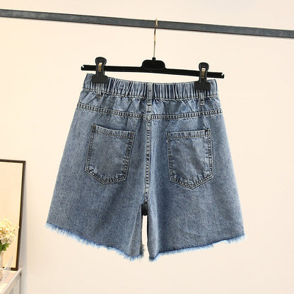 Damen Jeansshorts blau, hohe Taille, elastischer Bund, Fransen, Sommermode.