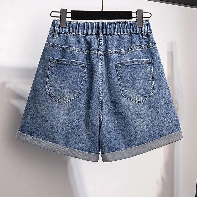 Damen Jeansshorts blau, elastischer Bund, aufgerollter Saum, zwei Gesäßtaschen, lässiger Stil.