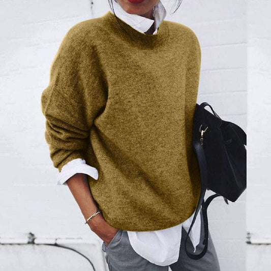 Damenpullover aus Wolle, senfgelb, lässig, Herbstmode, kombiniert mit weißem Hemd.