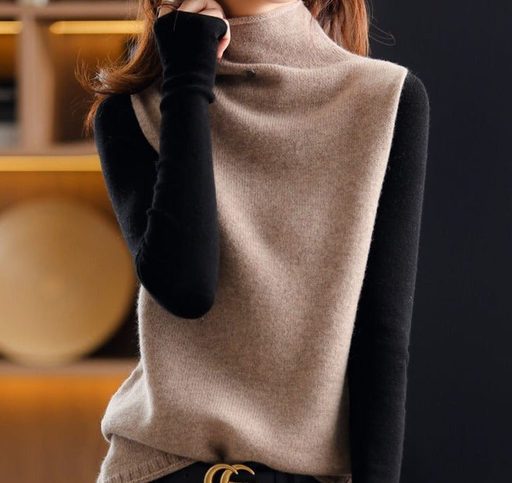 Frau trägt beige Rollkragenpullover mit schwarzen Ärmeln, elegantes Winteroutfit, Mode.