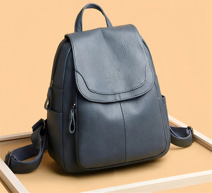 Grauer Leder-Rucksack, modisch, mit Reißverschlusstaschen, ideal für Damen, stilvoll und praktisch.