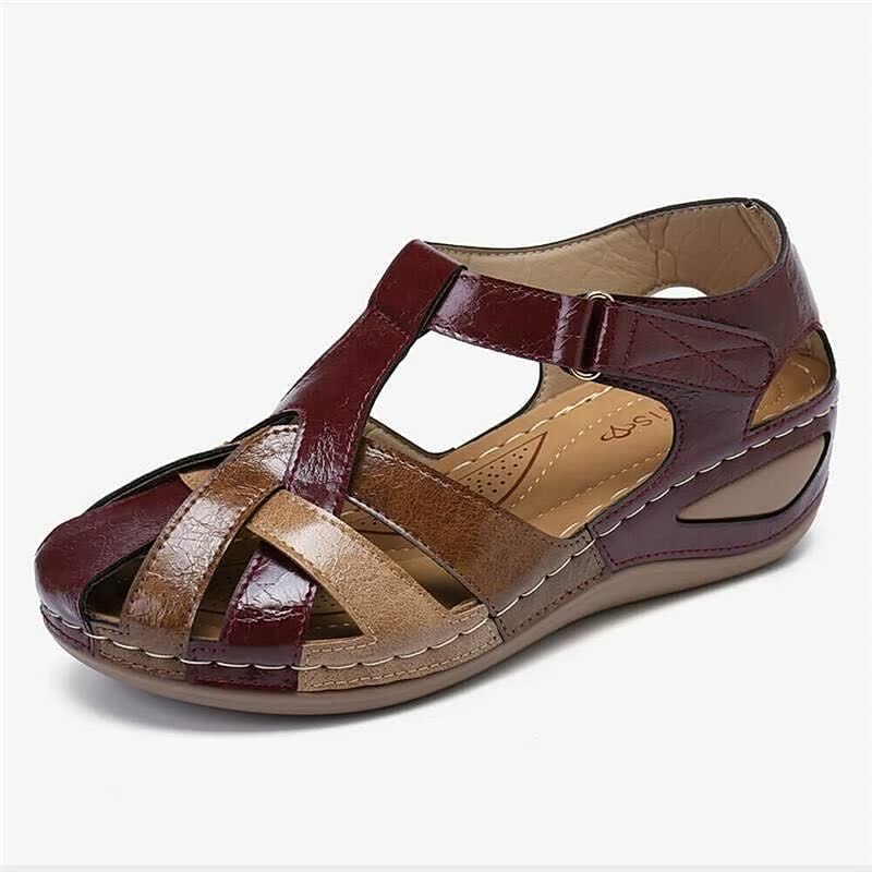 Braune Damen-Sandale aus Leder mit Klettverschluss, bequem und modisch.