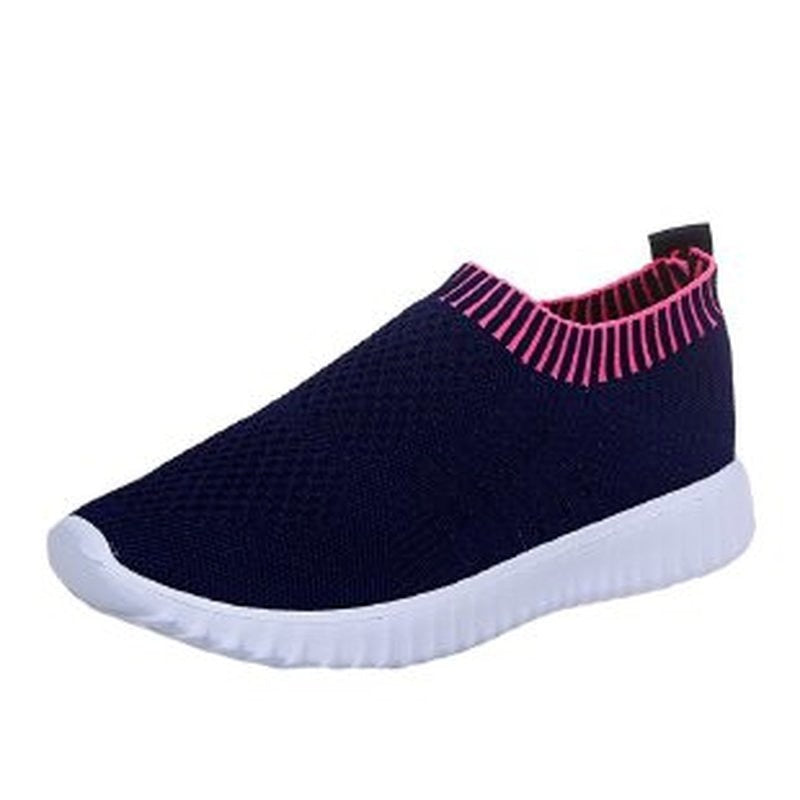 Dunkelblauer Sneaker mit weißer Sohle und pinkem Rand, atmungsaktives Mesh, Damen-Freizeitschuh.