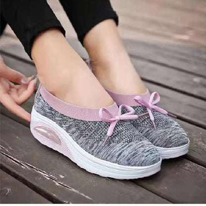Graue Damen-Sneaker mit rosa Schleifen, atmungsaktiv, rutschfest, ideal für Freizeit und Sport.