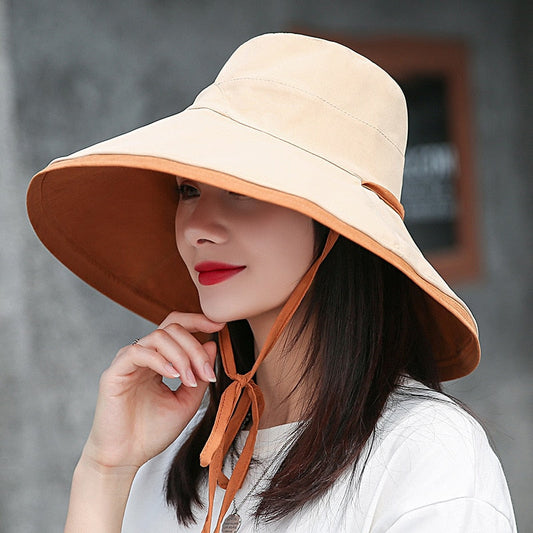Damen Sonnenhut beige, breiter Rand, UV-Schutz, Sommermode, Outdoor, elegant, stilvoll.