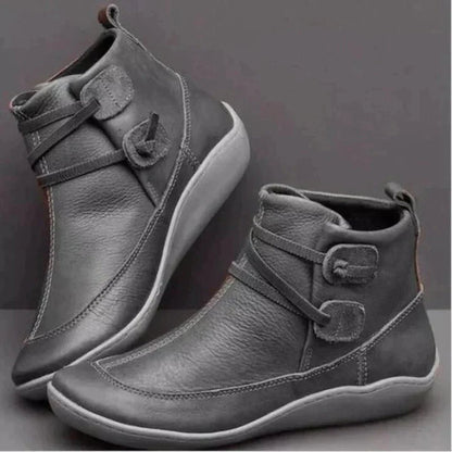 Graue Damenstiefeletten aus Leder mit Schnallen, rutschfeste Sohle, modisch und bequem.